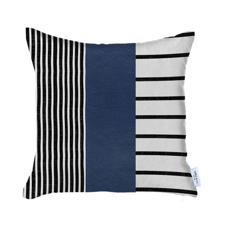 Rectangular striped throw pillow cover with navy faux leather panel and black-and-white stripes