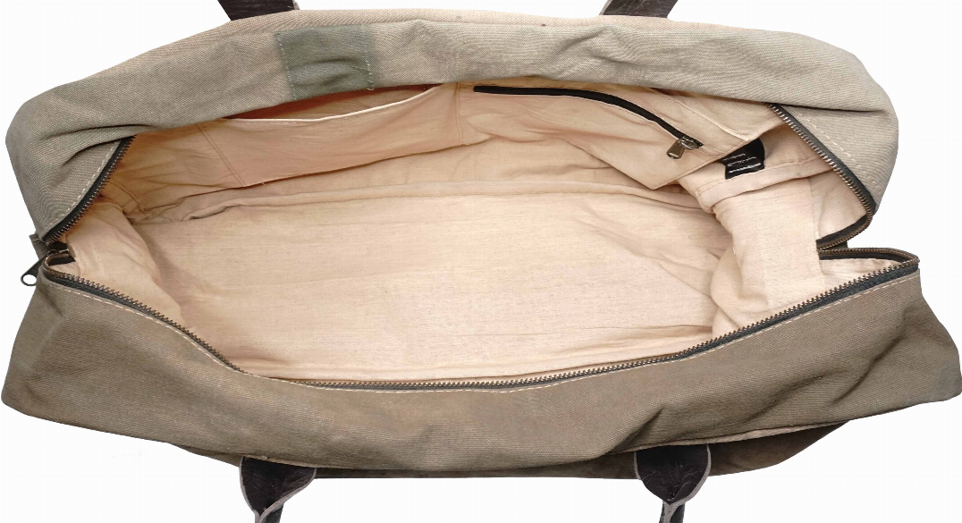 Khaki canvas travel bag open at top, showing light inner lining and front zipper