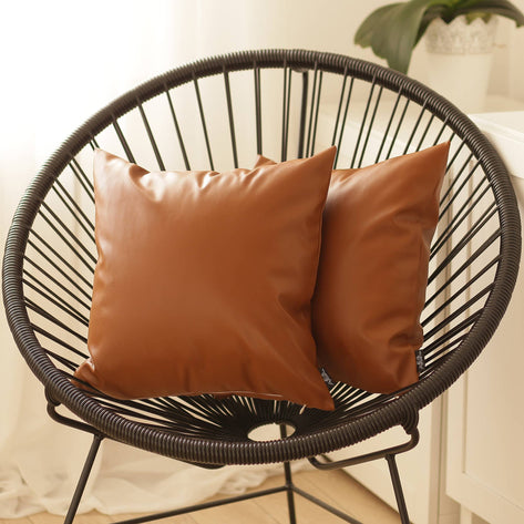 Brown square throw pillow covers in faux leather with smooth finish and neat seams