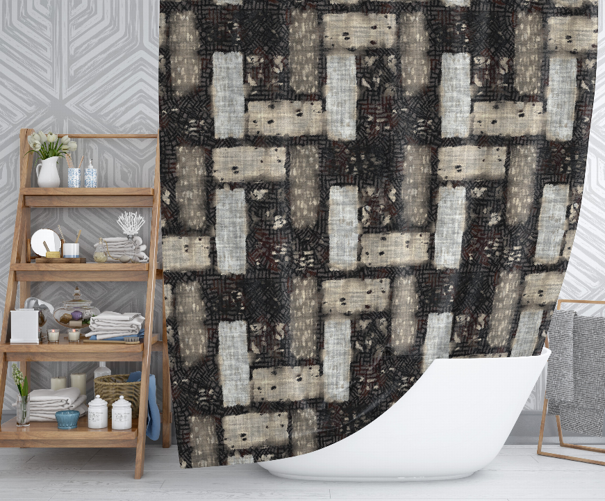 Geometric shower curtain with grid of black, gray, and cream blocks
