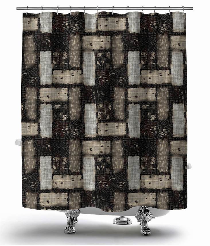 Black and cream geometric shower curtain hanging from rod, rectangular block pattern