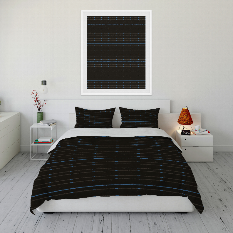 Duvet cover set on bed with black cover and blue stripe pattern, matching two pillow shams