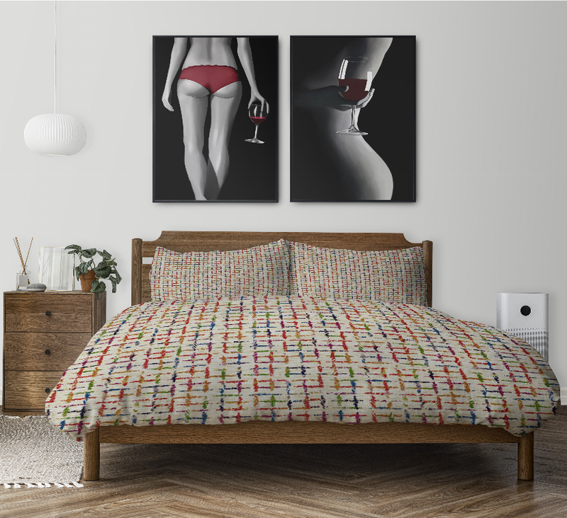 Multi-color duvet cover set on bed with two matching pillow shams, grid stripe pattern