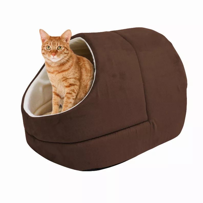 Brown cat cave bed with oval opening and light interior, orange tabby cat inside