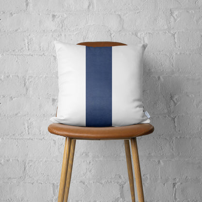 Throw pillow cover with white front and dark blue vertical stripe, faux leather finish