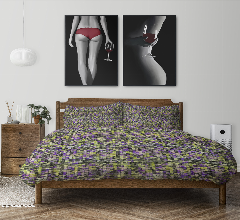 Multi-color speckled comforter and two pillow shams on a wooden bed frame.