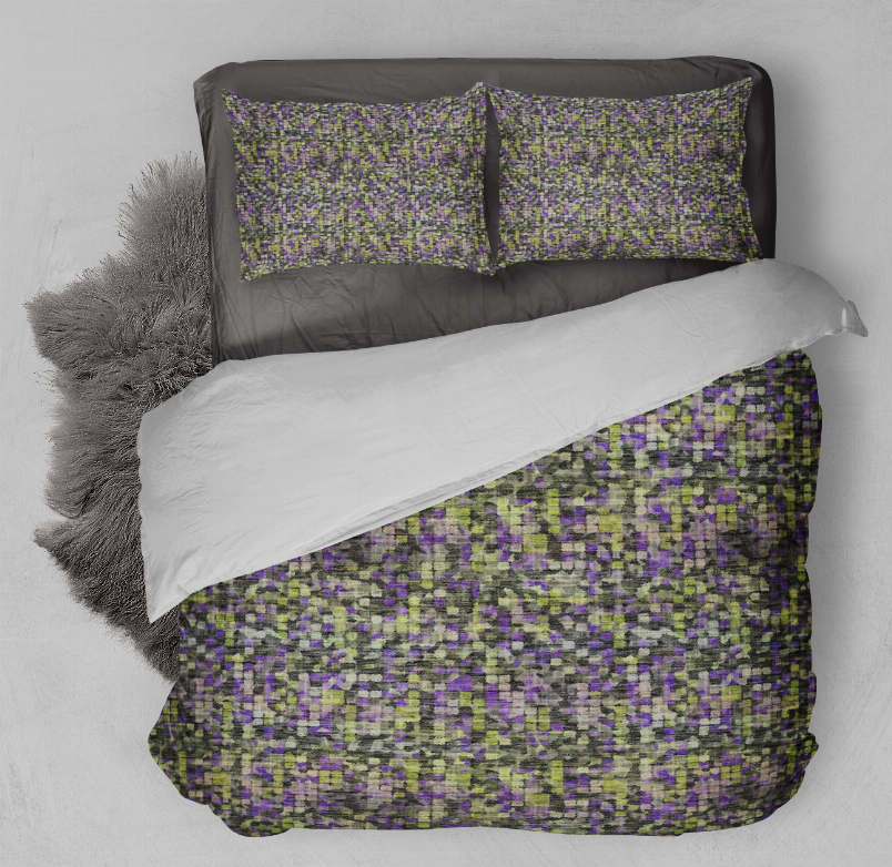 Speckled multi-color comforter set with two pillow shams, bed top view.