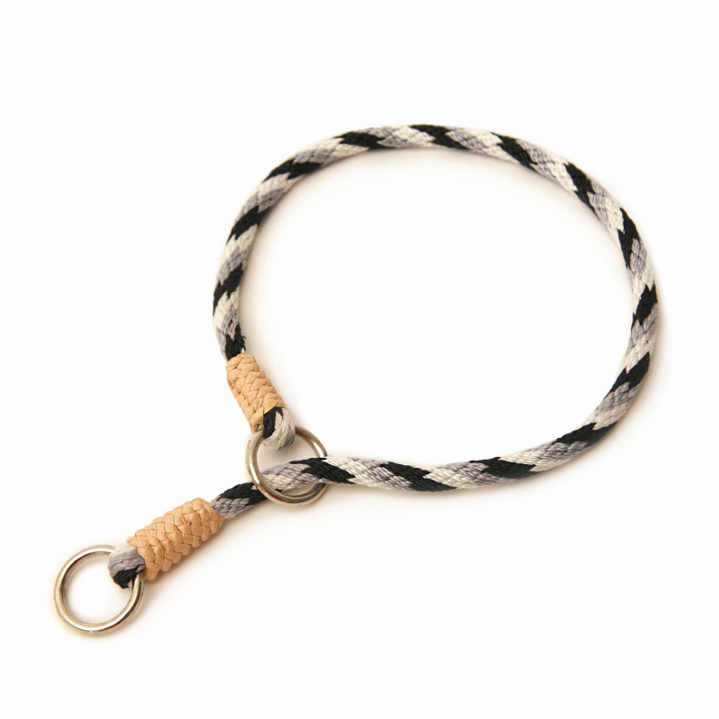 Nylon slip collar with woven black-and-white strap, tan braided section, and metal ring