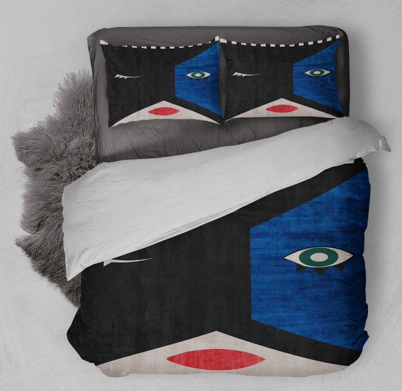 Comforter set with black and blue panels, red accents; two matching decorative pillows.