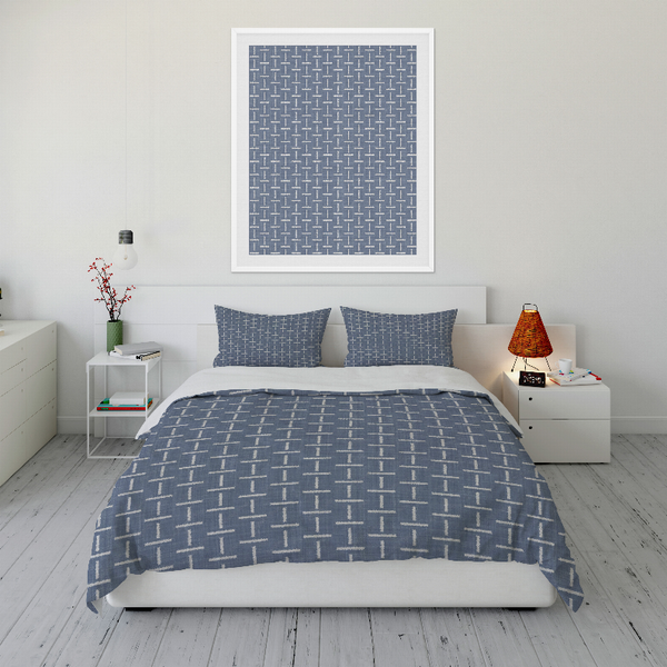 Blue comforter set with white geometric grid pattern and two matching pillow shams