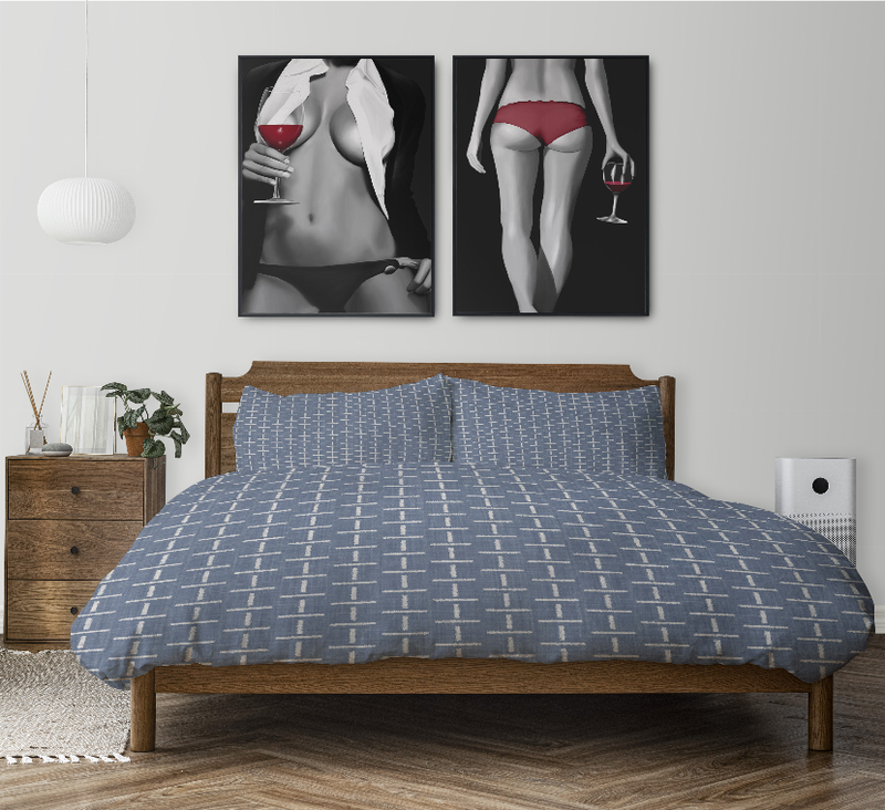 Blue comforter set with white vertical grid pattern and two matching shams