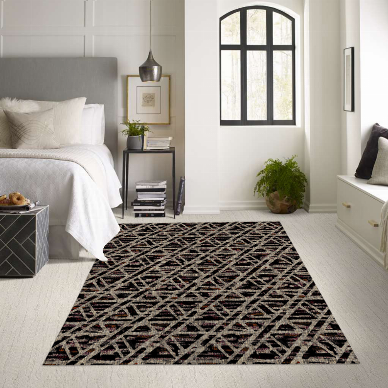 Low pile carpet with multicolor geometric pattern on dark base