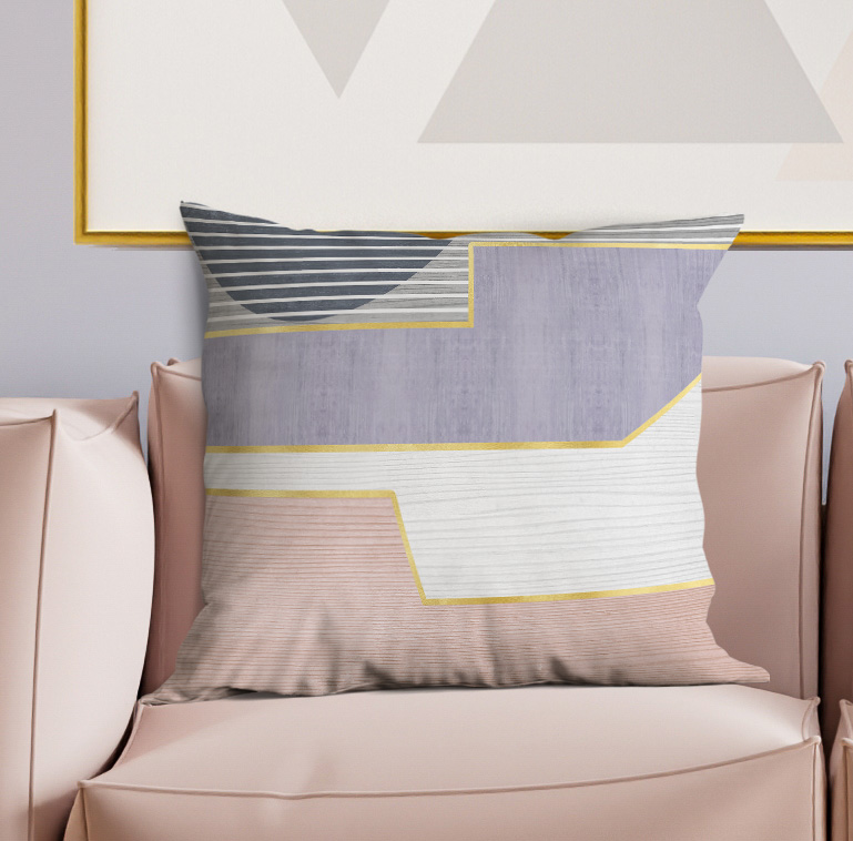 Geometric throw pillow with gray and white panels, navy stripes, and yellow trim