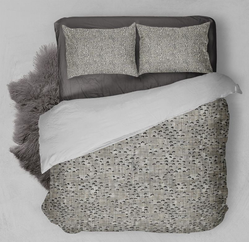 Speckled comforter set with two square pillows, light gray patterned bedding