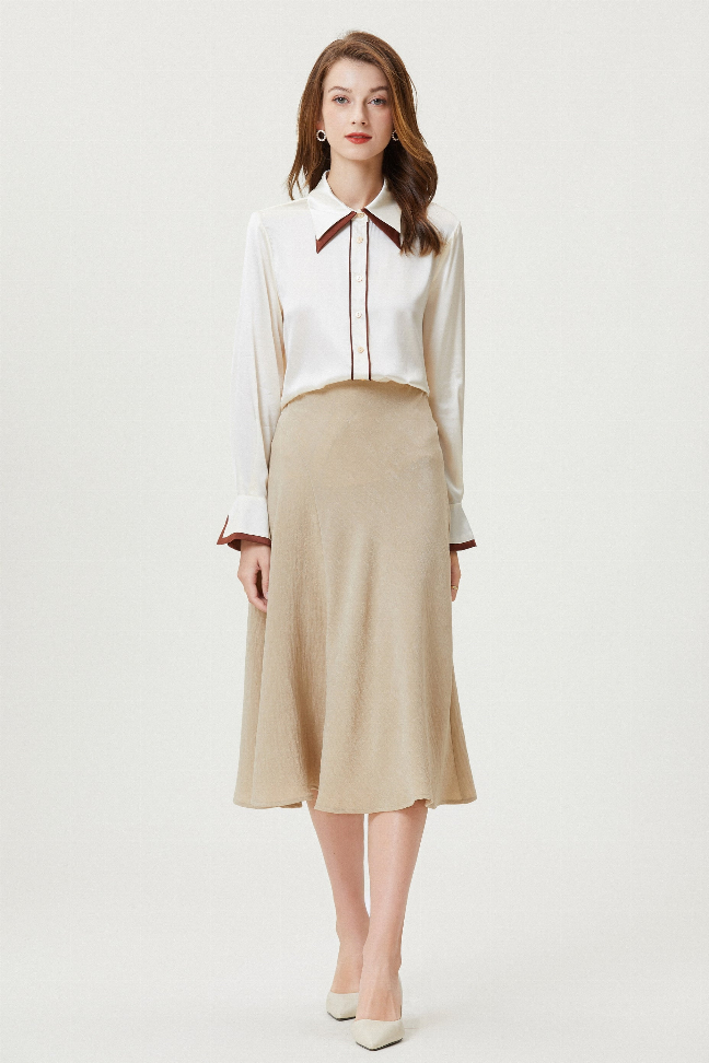 Cream silk button-up blouse with brown-trim pointed collar and long sleeves