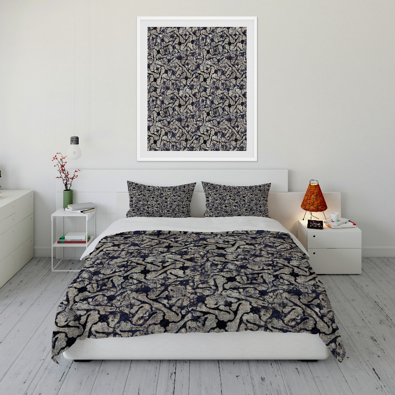 Blue and dark patterned comforter set with two pillow shams on bed