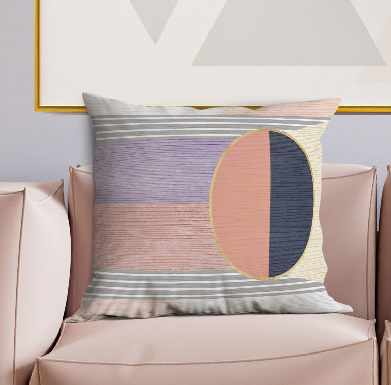 Gray and lavender striped pillow with orange-and-navy oval accent