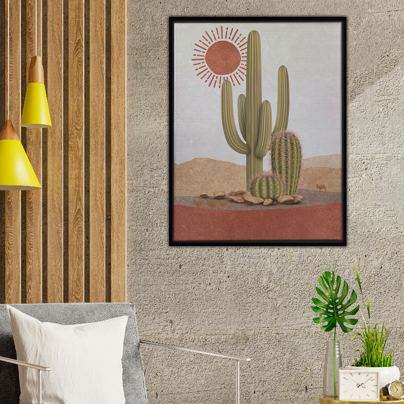 Framed cactus art print on beige wall with tall green cacti and red sun