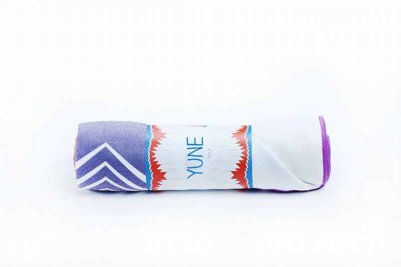 Yoga towel roll with zigzag stripes and YUNE text, light blue with purple side