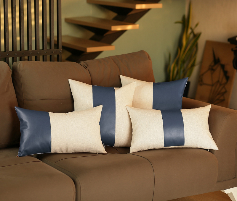 Set of 4 throw pillows with cream and dark blue faux-leather look strip panels