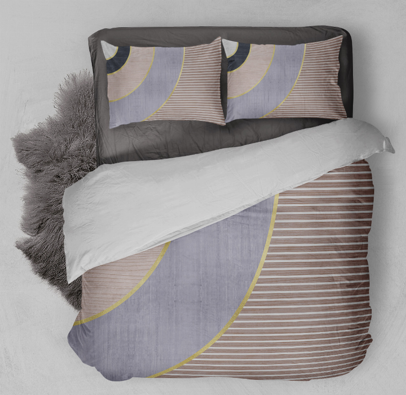 Comforter set with two pillow shams and gray comforter, curved yellow lines over tan stripes
