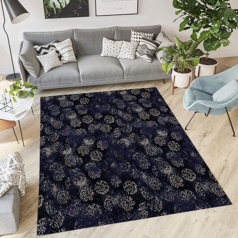 Low pile navy carpet with repeating gold-tone floral motifs