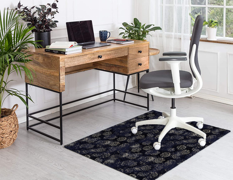 Low pile navy carpet with dark gold floral pattern under office chair