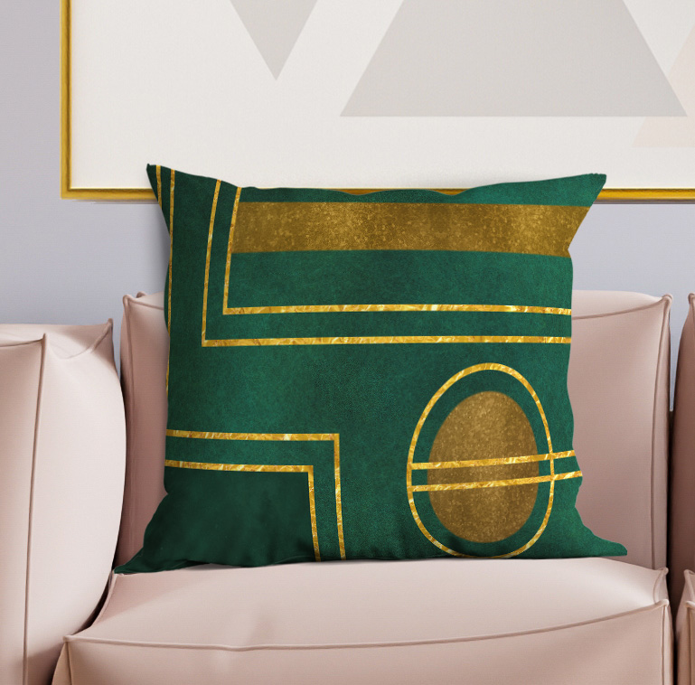 Green decorative throw pillow with gold geometric frame and oval emblem