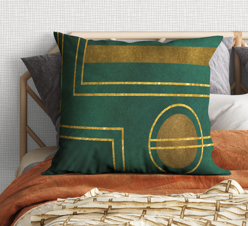 Green decorative bed pillow with gold framed pattern and oval emblem