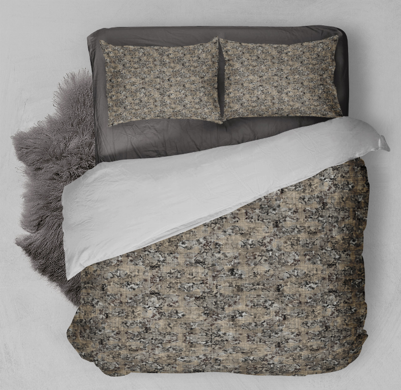 Gray speckled comforter set featuring two pillow shams and a layered duvet