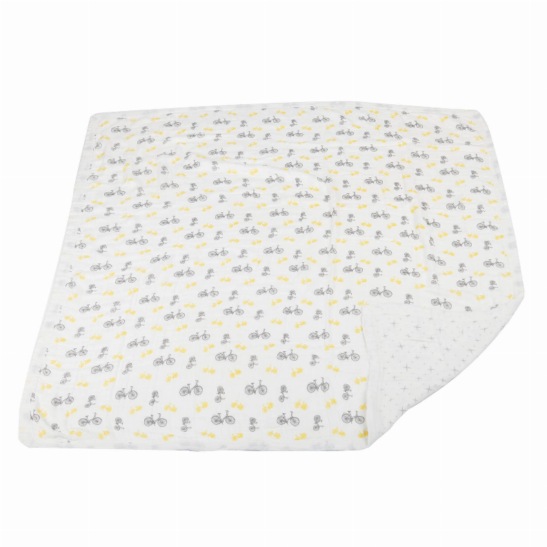 Bamboo blanket with gray and yellow bicycle print, folded corner view