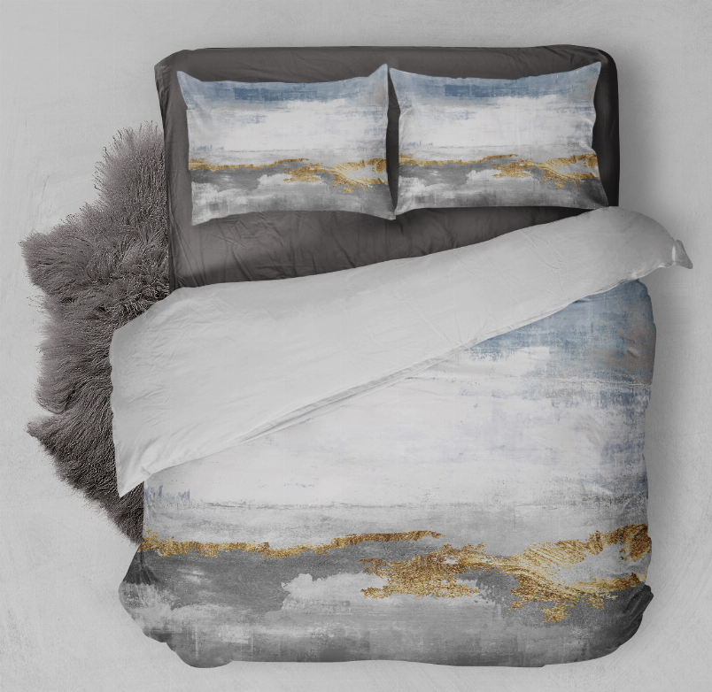 Comforter set with two pillow shams, white base with light blue and gold accents.