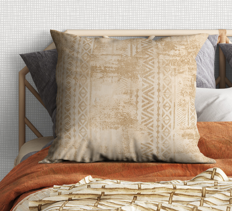 Beige square throw pillow with distressed geometric pattern, piped edges