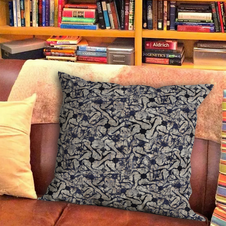 Navy and gray abstract patterned throw pillow with stitched edge