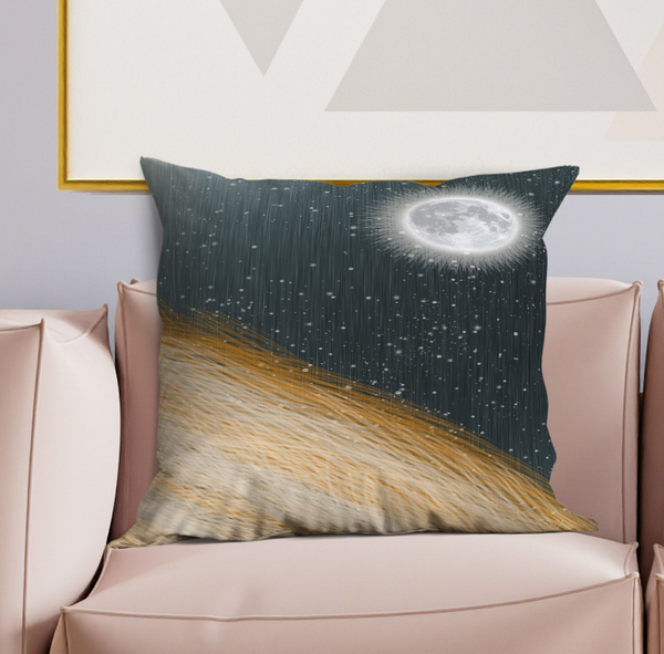 Decorative throw pillow with dark blue starry texture and glowing moon on top corner