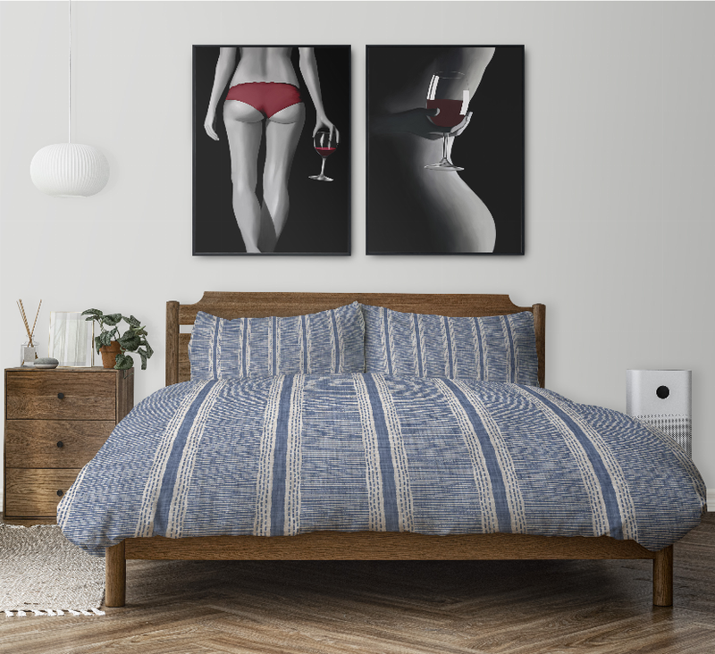 Blue striped comforter and two matching shams for a wooden bed