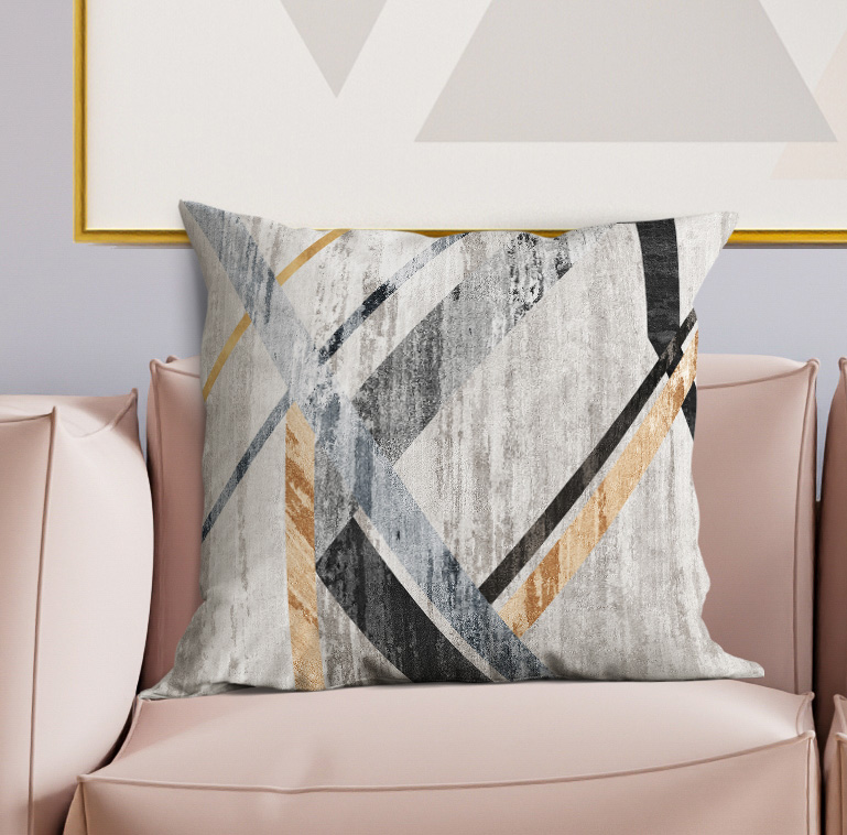 Geometric decorative throw pillow, light gray with navy and blue X lines and gold accents