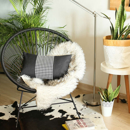 Dark gray throw pillow with black-and-white houndstooth vertical stripe and black sides