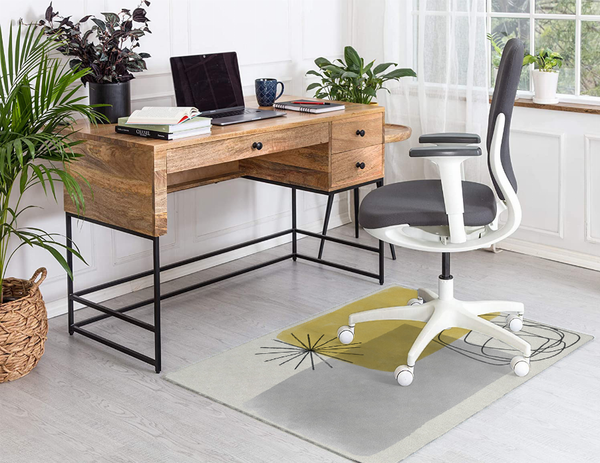 Low pile multi-color rug with gray base, yellow squares, and black starburst lines
