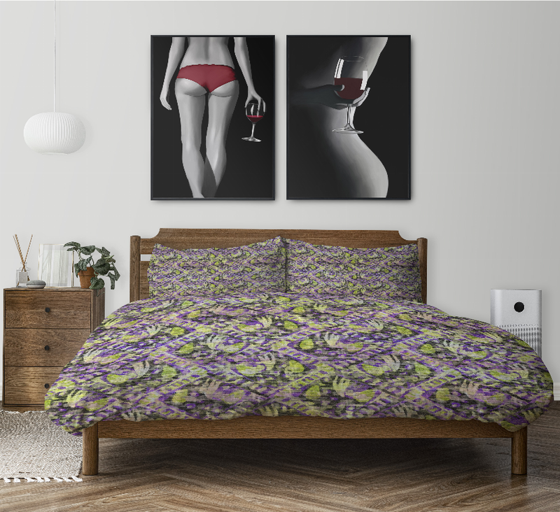 Multi-color comforter set on bed, purple and green abstract comforter with two shams