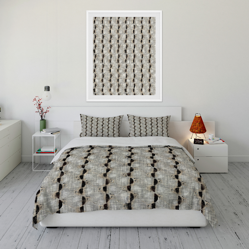 Comforter set featuring off-white fabric with black vertical dot stripe pattern and two matching shams