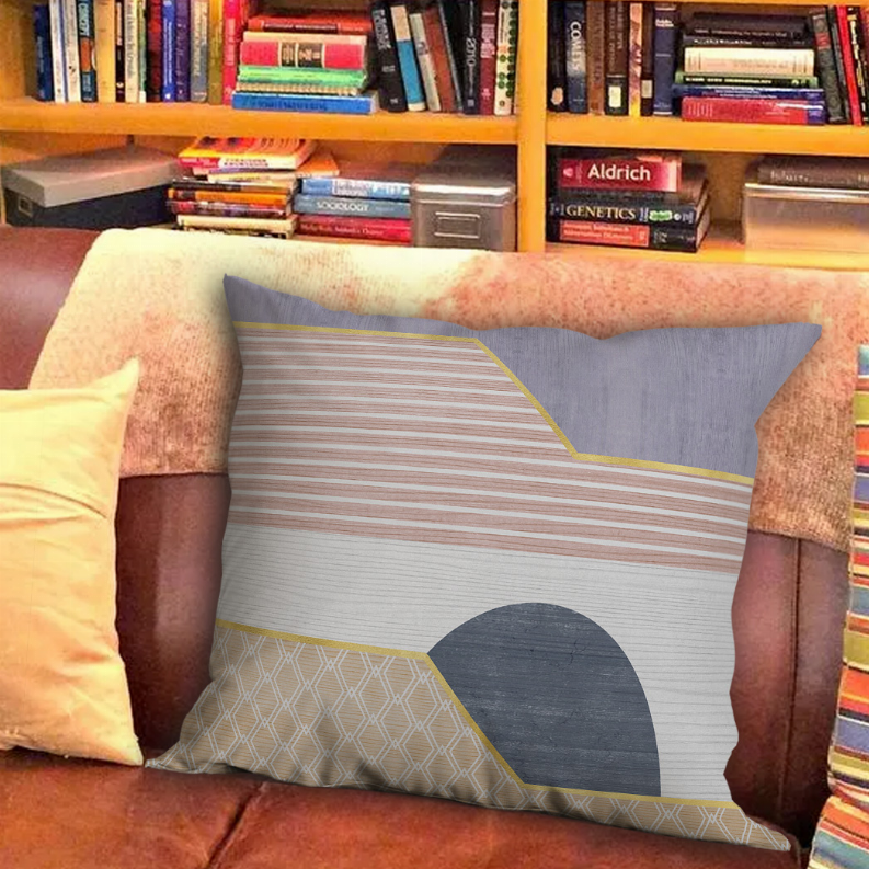 Square pillow cover with gray lavender top, beige diamond section, and navy circle
