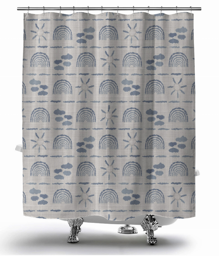 Blue and gray shower curtain with repeating rainbow, cloud, paw, and starburst pattern