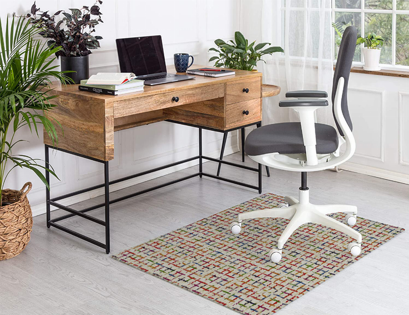 Low-pile multicolor carpet with red, blue, and green rectangular grid pattern