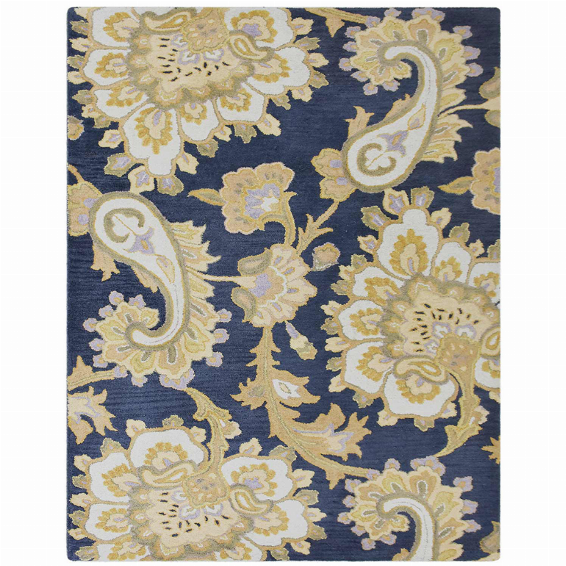 Hand-tufted wool area rug with navy background and cream-gold floral motifs