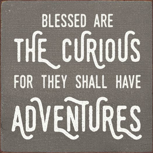 Gray square inspirational quote print with white typography: Blessed are the curious