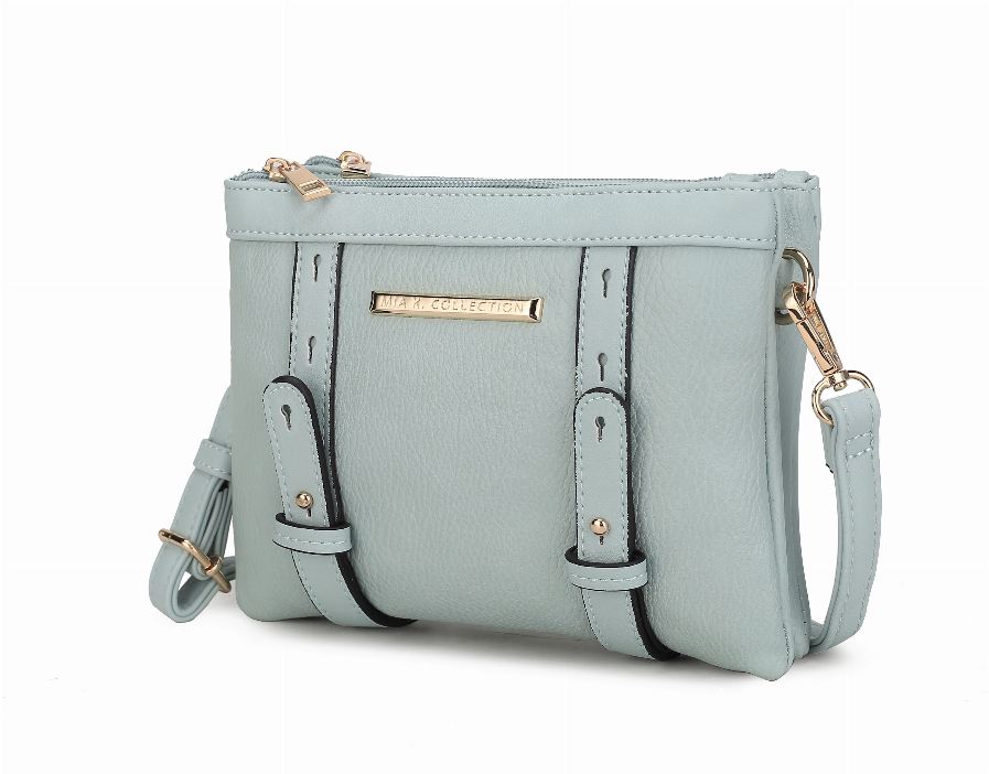 Light blue crossbody bag with two front strap pockets, top zipper, gold hardware, side handle