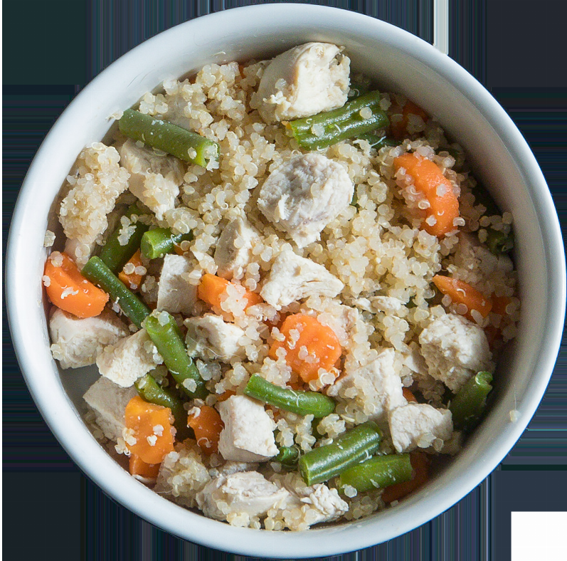 Chicken and vegetable grain bowl in a white serving bowl