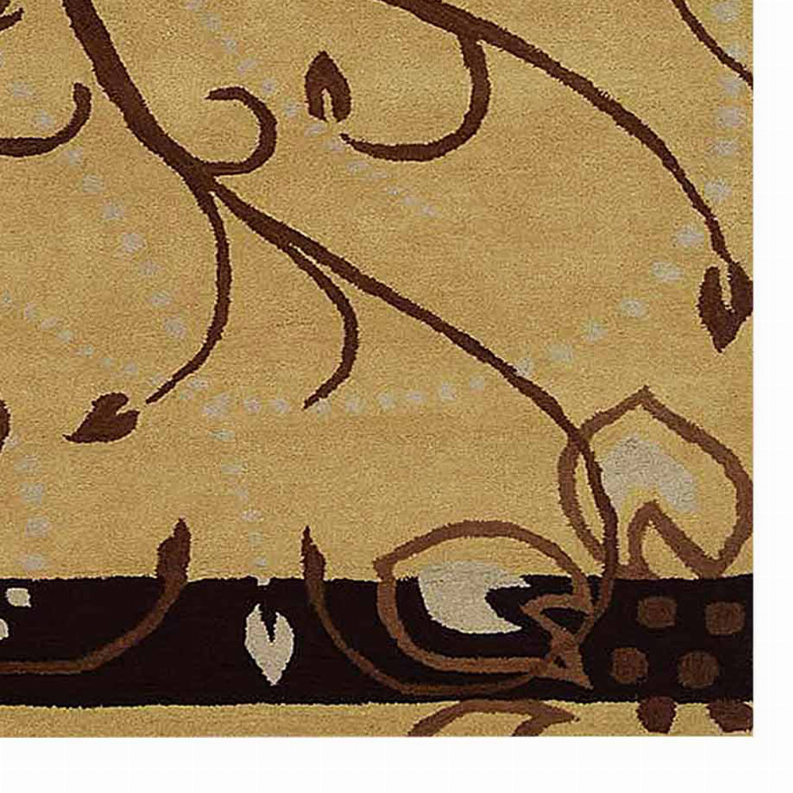 Floral hand-tufted wool rug detail, beige background with brown vine and dark border
