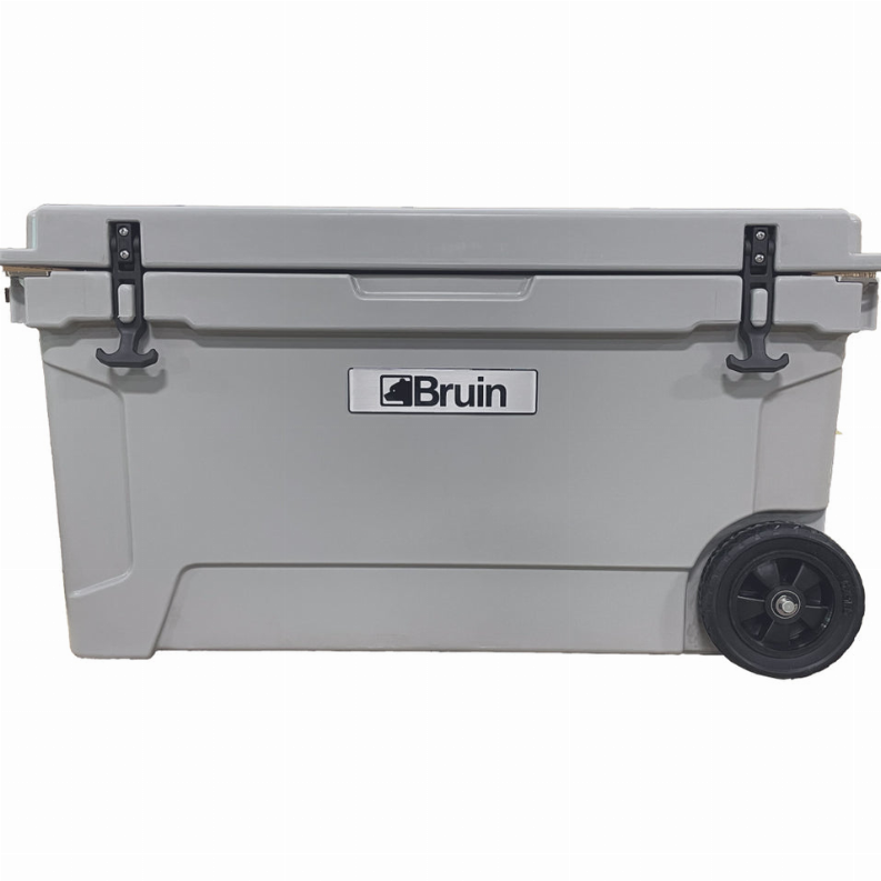 Front-view gray roto-molded cooler with Bruin logo, latches and front wheel.